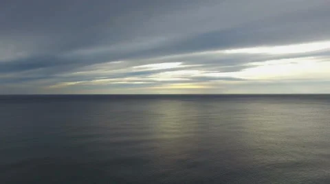 Rising sun behind dark clouds Stock Footage 58553851