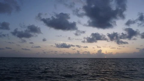 Rising sun on the horizon above a calm ocean Stock Footage 88678317