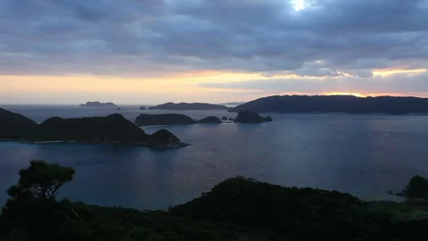 The Rising Sun over Kerama Strait and the Flowing Clouds Stock Footage 330149840