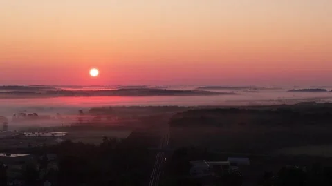Rising sun over small town Stock Footage 295366646