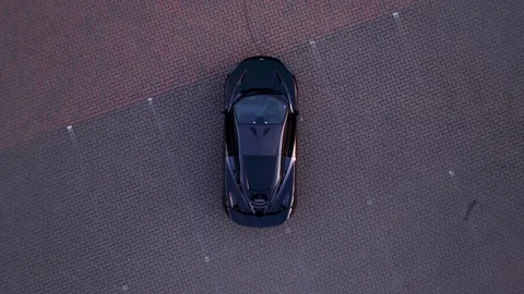 Rising vertical drone shot over black McLaren 720S 動画素材 277389193