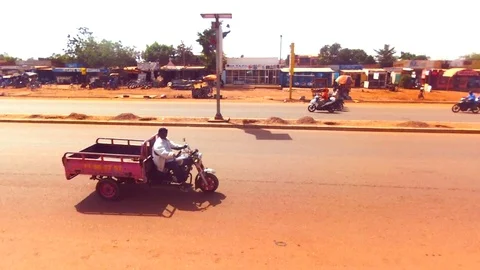 Rising view of a Ouaga street Stock Footage 80638199