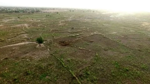 Rising view over fields out of Ouaga Stock Footage 80805837