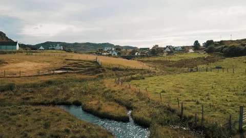 Rising view over a small scottish town by the sea - Drone 4K 動画素材 113743024