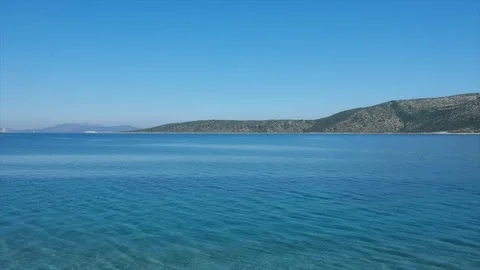 Rising the view from sea level upwards showing the deep blue ocean Stock Footage 174850339