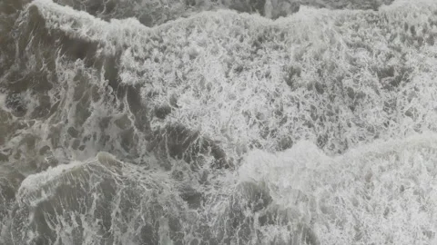 Rising view of waves rolling into beach Stock Footage 221426317