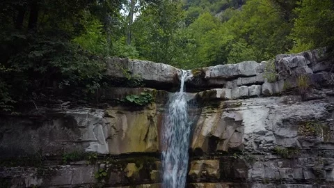 Rising up a waterfall. Cascade view of river, stream. Water stream isolated Stock Footage 162499854