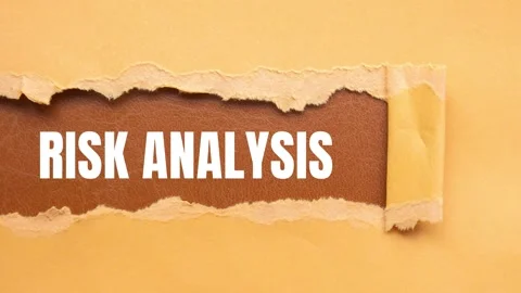 Risk Analysis message written on ripped torn paper background Stock Footage 318355700
