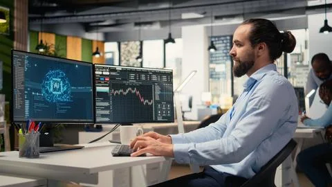 Risk analyst using artificial intelligence to assess stock market volatility Stock Photos