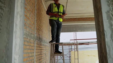 The risk of the construction worker is climbing a ladder Stock Footage 241347392