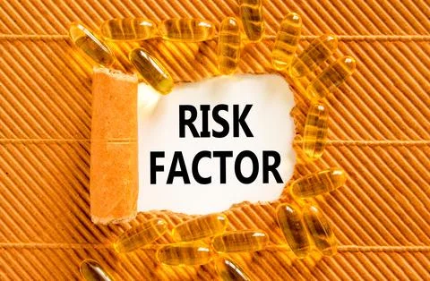 Risk factor symbol. Concept words Risk factor on beautiful white paper. Yel.. Stock Photos
