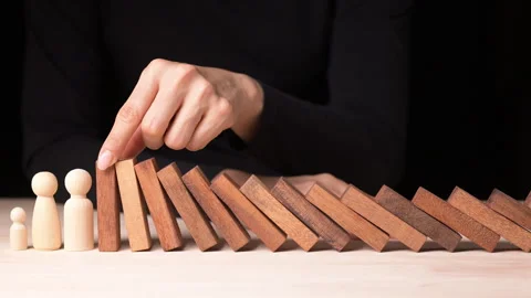 Risk Management and Decision Making in Business Crisis Hand Stopping Falling Video stock 296262396
