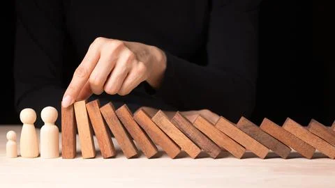 Risk Management and Decision Making in Business Crisis Hand Stopping Falling Stock Photos