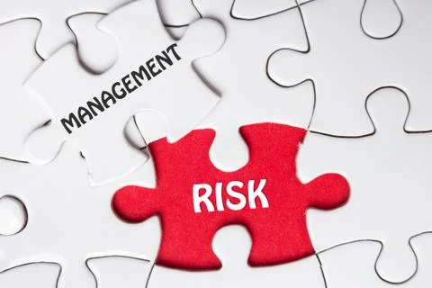 Risk Management. Missing jigsaw puzzle pieces with text Photos