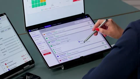 Risk Manager Analyzes Compliance Data On Dual-screen Laptop Stock Footage 338170511