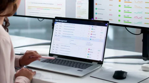Risk Manager Carefully Analyzes Financial Data On Laptop Stock Footage 335882491