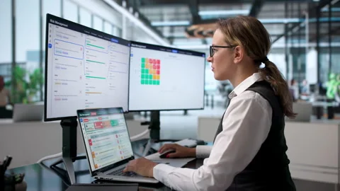Risk Manager Carefully Assessing Enterprise Data Stock Footage 340999855