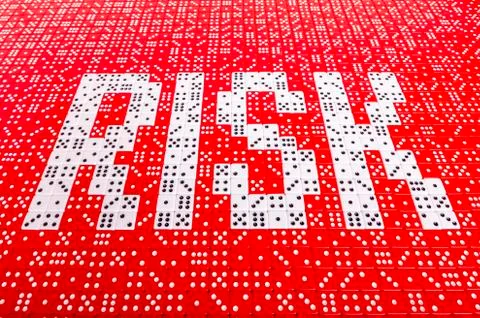 RISK spelled with dice 2 Stock Photos