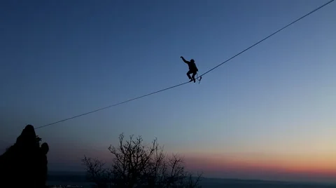Risk Taking Extreme Tight Rope Walker Accomplishes Dangerous High-Wire Feat Stock Footage