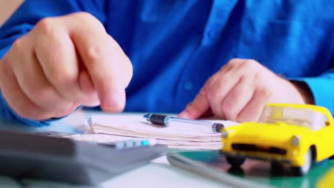 Risk underwriter computing accident probability and processing financial audit 스톡 동영상 337674172