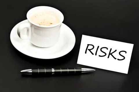 Risks message on desk with coffee Stock Photos
