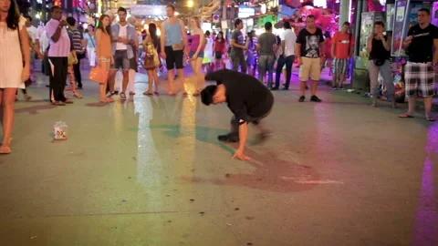 Risky dance moves performed by a man on street of Bangla Road. Stock Footage 130955504