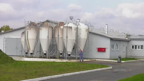 Risky job. Worker washes a bunker where grain is stored. Video stock 111719796