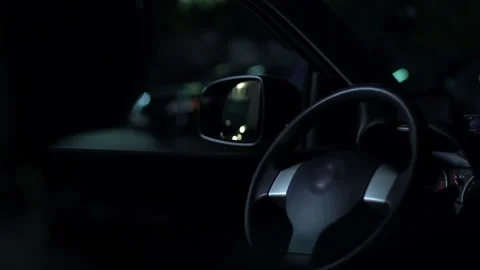 Risky robber breaking lock and worming into vehicle, starting engine, carjacking Stock Footage 99264901