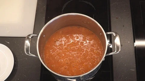 Risotto boiling overhead Stock Footage 112127901