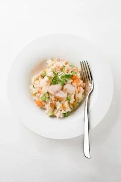 Risotto with chicken on table Stock Photos
