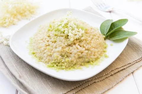 Risotto with elderflowers Stock Photos