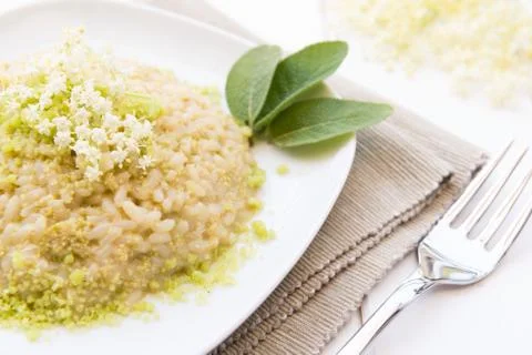 Risotto with elderflowers Stock Photos