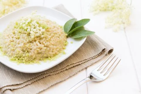 Risotto with elderflowers Stock Photos