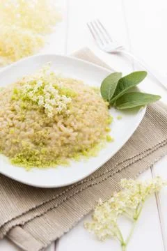 Risotto with elderflowers Stock Photos