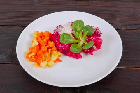 Risotto with red beet on a table Foto stock