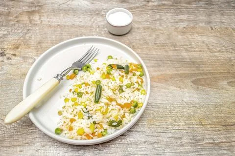 Risotto rice with vegetables and spices served on plate.Rustic lunch dinner.. Foto stock