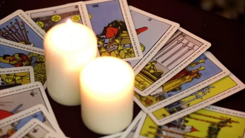 A rite for summoning spirits with ancient tarot cards on table. Occult concept. Stock Footage 108017193