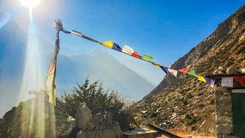 Ritual flags in the sunbeams. 库存照片
