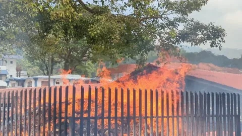 A ritual involving burning things in a huge fire Stock Footage 233480133