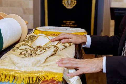 Ritual preparation of Torah scroll during religious service at synagogue Stock Photos