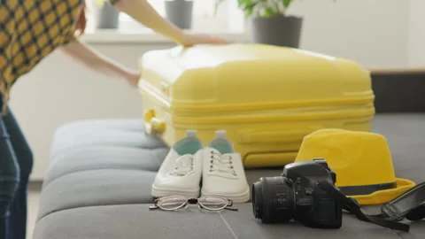 Ritual preparation where hand that opens suitcase symbolizes beginning of the Stock Footage 245066558