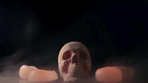 Ritual with a skull surrounded by candles Vídeos de archivo 134696036