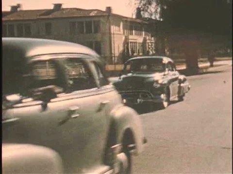 Rival gangs drive to a fighting location in the 1950s. Stock Footage 75287353