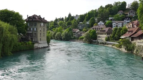 River Aare in Bern viewed from a bridge with people swimming in it Stock Footage 345620049