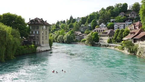 River Aare in bern viewed from a bridge with people swimming in it 2 Stock Footage 345620067