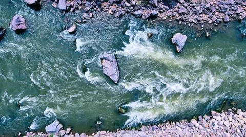 River aerial looking down on rapids and rocks Stock Photos