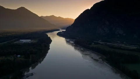 River Alongside Road and Mountain Stock Footage 120893645