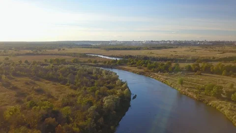 River among fields and trees autumn landscape and cityscape on horizon Stock Footage 98847492