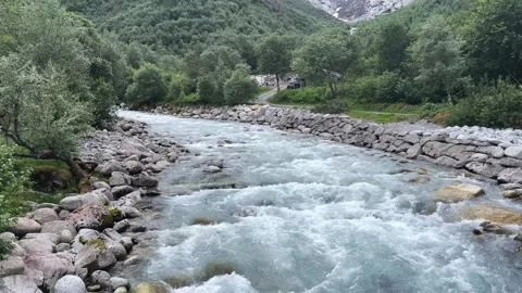 A river among mountains and forests Video stock 337364962