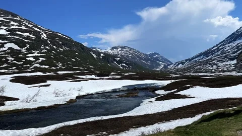 River among snow-capped mountains Trollstigen Stock Footage 308162536